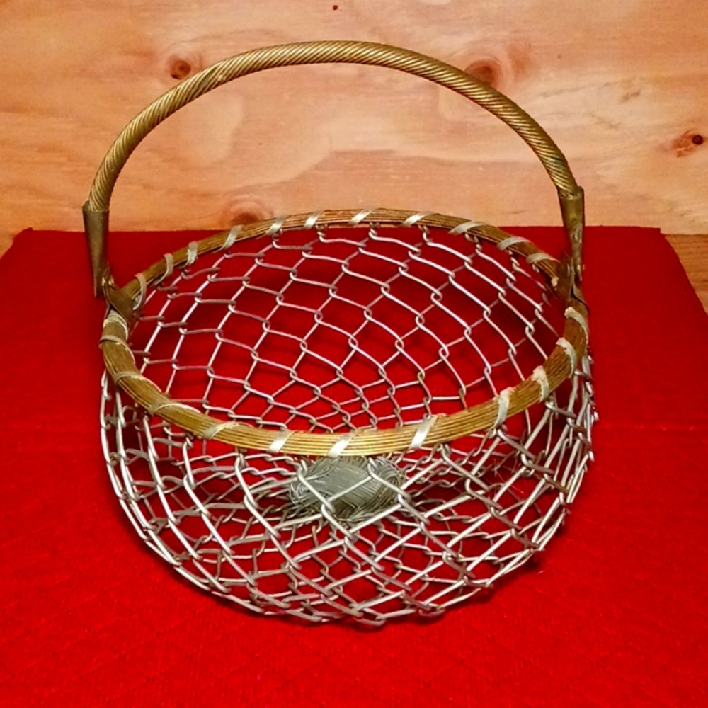 Chain link fence style basket with brass rim and handle